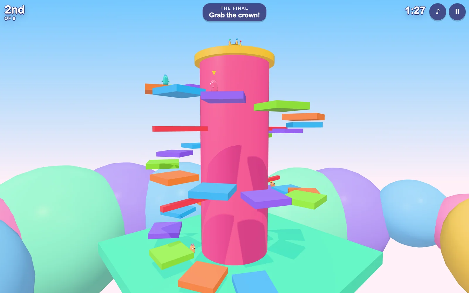 The Crown Climb final: a spiral of colourful platforms winding up a tall pink mountain toward a golden crown
