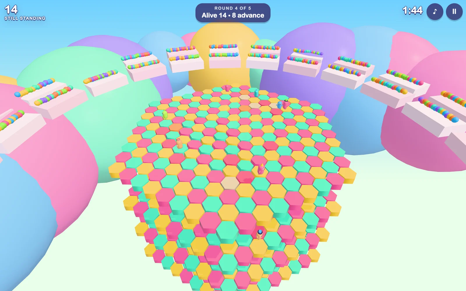 The Hex-a-Gum round: a field of pink, yellow and mint hexagon tiles with beans running across them